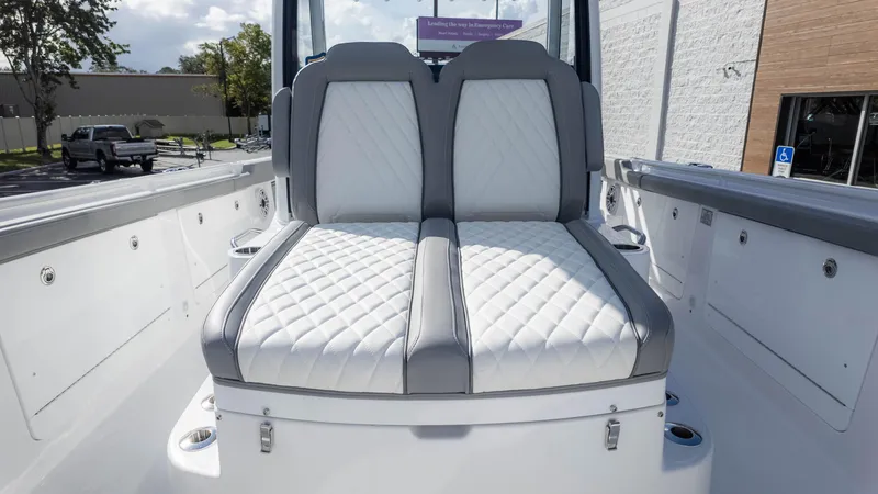 Slide: The Image of 2025 Everglades 315 Center Console boat with luxurious white and gray seating. - 32