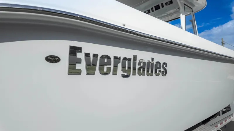 Slide: The Image of 2025 Everglades 315 Center Console boat with sleek design and logo. - 7