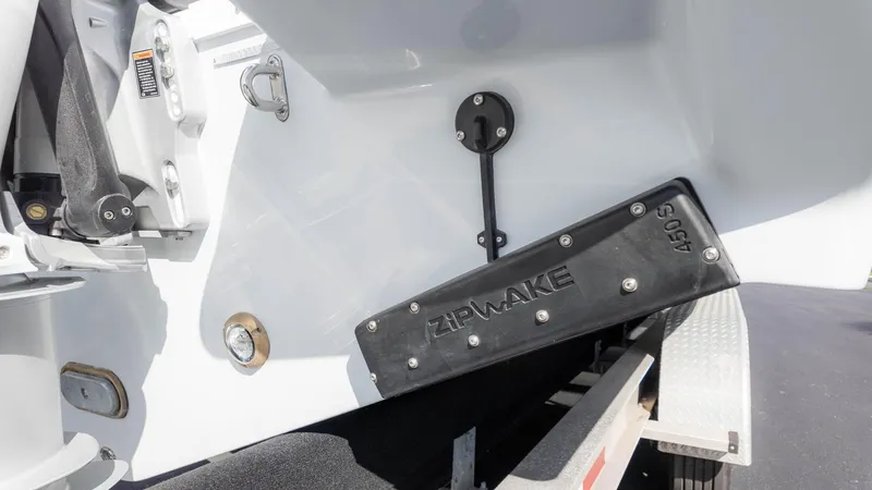 Slide: The Image of Close-up of 2025 Everglades 315 Center Console boat's hull and trailer. - 9