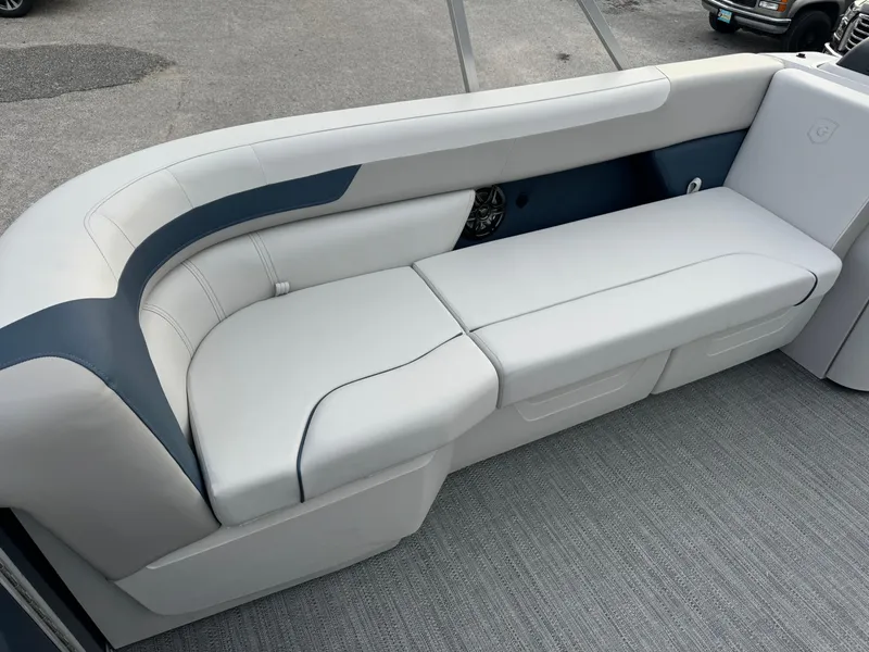 Slide: The Image of 2025 Sweetwater 2286 SB boat seating with gray upholstery and modern design. - 3