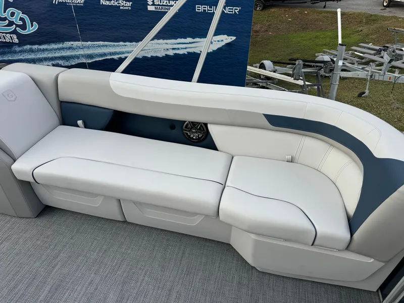 Slide: The Image of 2025 Sweetwater 2286 SB boat interior with white and gray seating. - 4