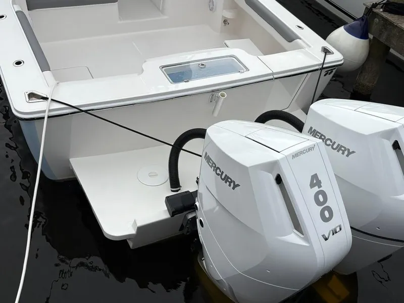 Slide: The Image of 2025 Albemarle 30 Express with twin Mercury 400 V10 engines at dock. - 11