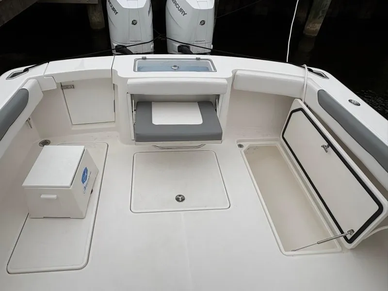 Slide: The Image of 2025 Albemarle 30 Express boat deck with storage compartments and seating. - 13