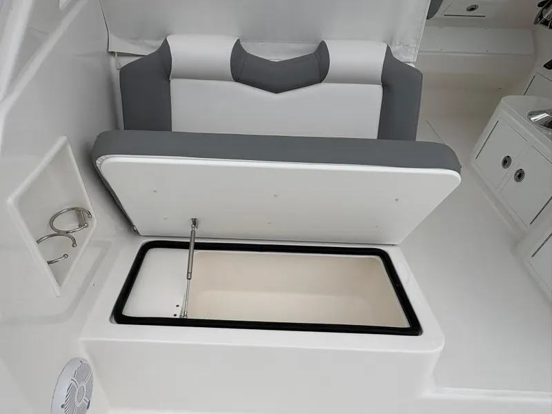 Slide: The Image of 2025 Albemarle 30 Express boat seat with storage compartment open. - 14