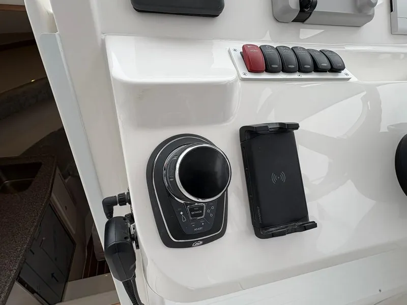 Slide: The Image of Control panel of 2025 Albemarle 30 Express boat with modern features. - 17