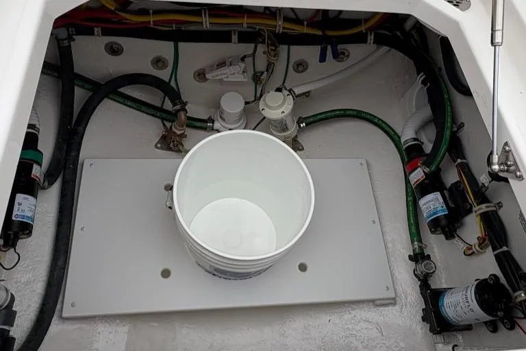 Slide: The Image of Engine compartment of 2025 Albemarle 30 Express boat with visible wiring and hoses. - 21