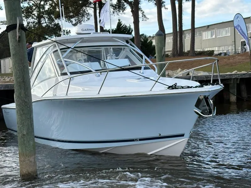 Slide: The Image of 2025 Albemarle 30 Express boat docked near a marina. - 3