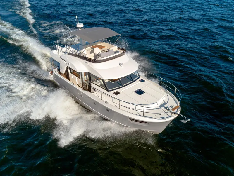 Slide: The Image of 2024 Beneteau Swift Trawler 41 cruising on open water. - 11