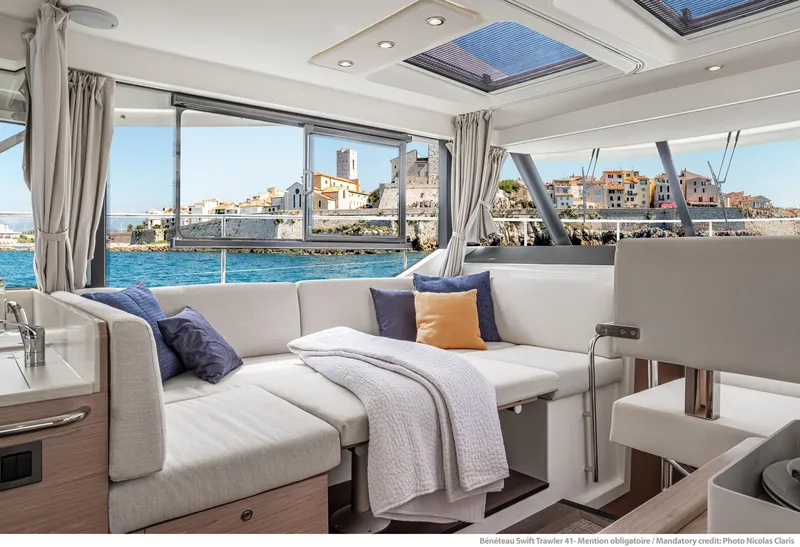 Slide: The Image of Luxurious interior of 2024 Beneteau Swift Trawler 41 with scenic ocean view. - 24