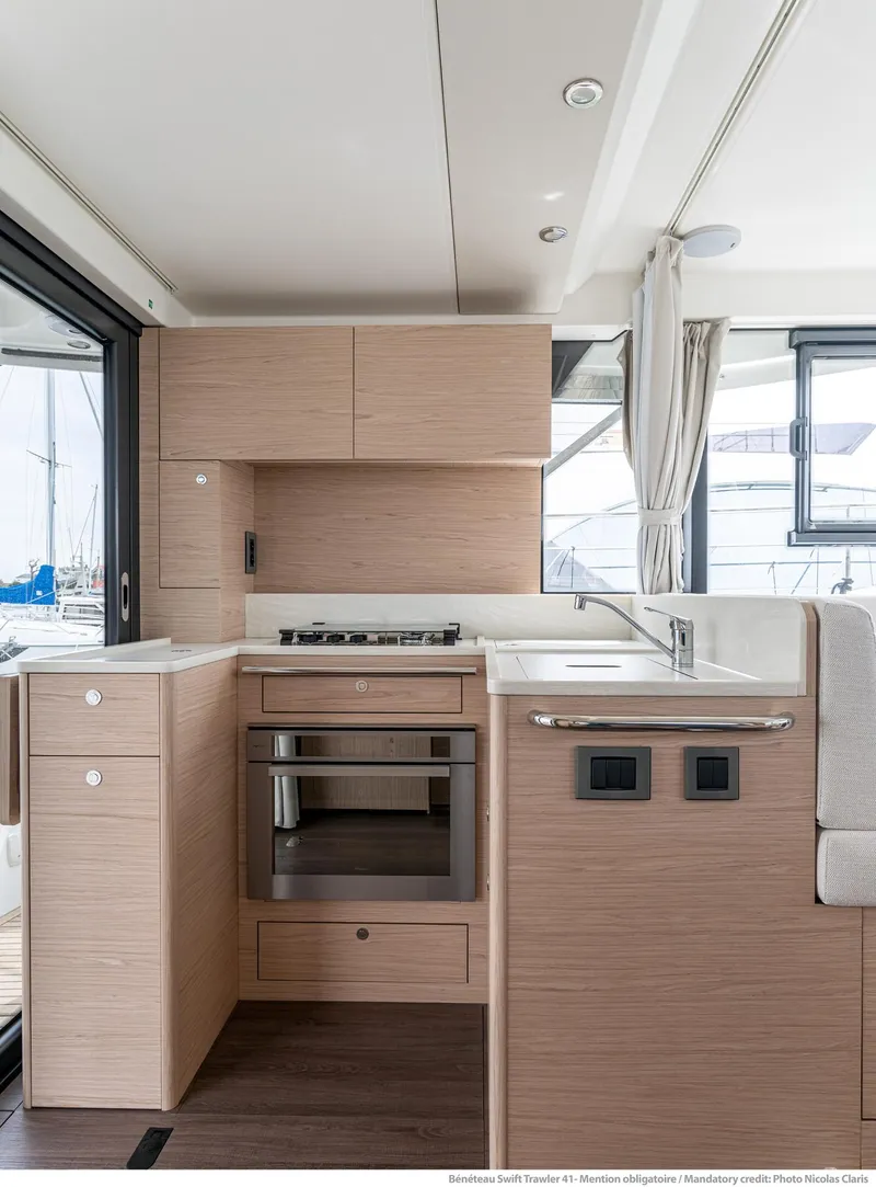 Slide: The Image of 2024 Beneteau Swift Trawler 41 kitchen with modern appliances and sleek design. - 27