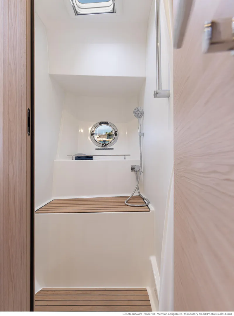 Slide: The Image of 2024 Beneteau Swift Trawler 41 bathroom with modern fixtures and wooden accents. - 30