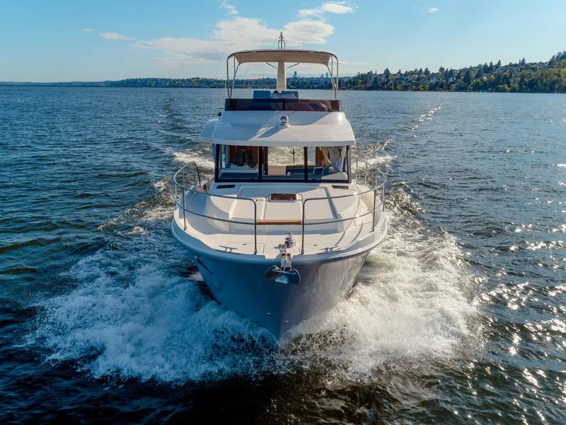 Slide: The Image of 2024 Beneteau Swift Trawler 41 cruising on open water. - 13