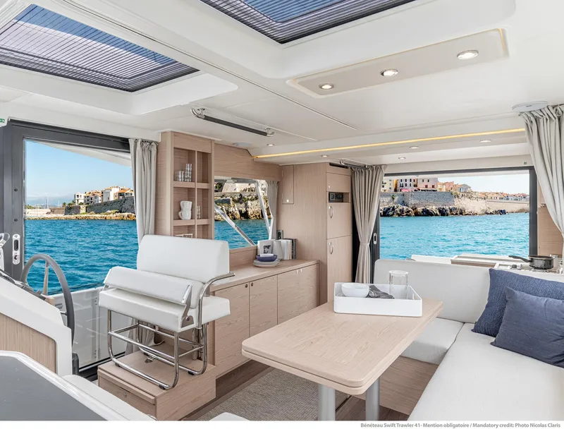 Slide: The Image of Interior of 2024 Beneteau Swift Trawler 41, featuring modern design and ocean view. - 37