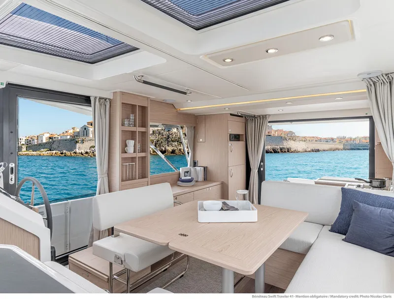 Slide: The Image of Luxurious interior of 2024 Beneteau Swift Trawler 41 with ocean view. - 38