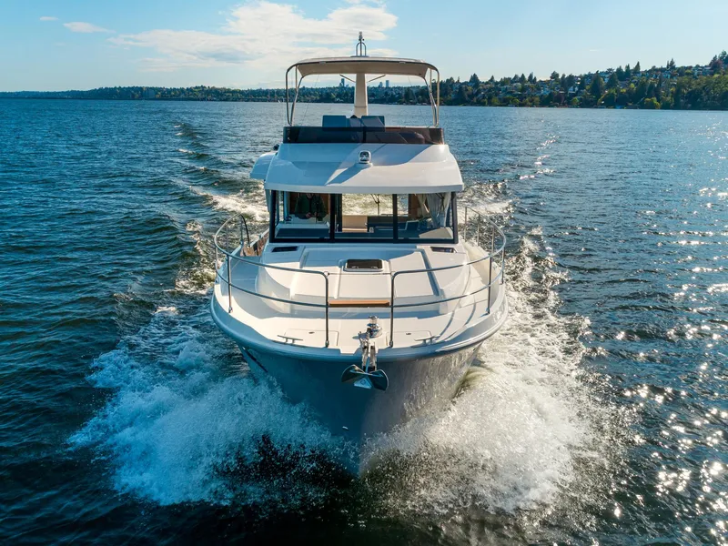 Slide: The Image of 2024 Beneteau Swift Trawler 41 cruising on open water. - 5