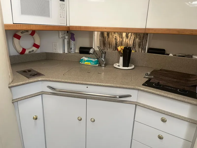 The Image of 1998 Formula 41PC yacht kitchen with modern appliances and sleek countertops. - 1