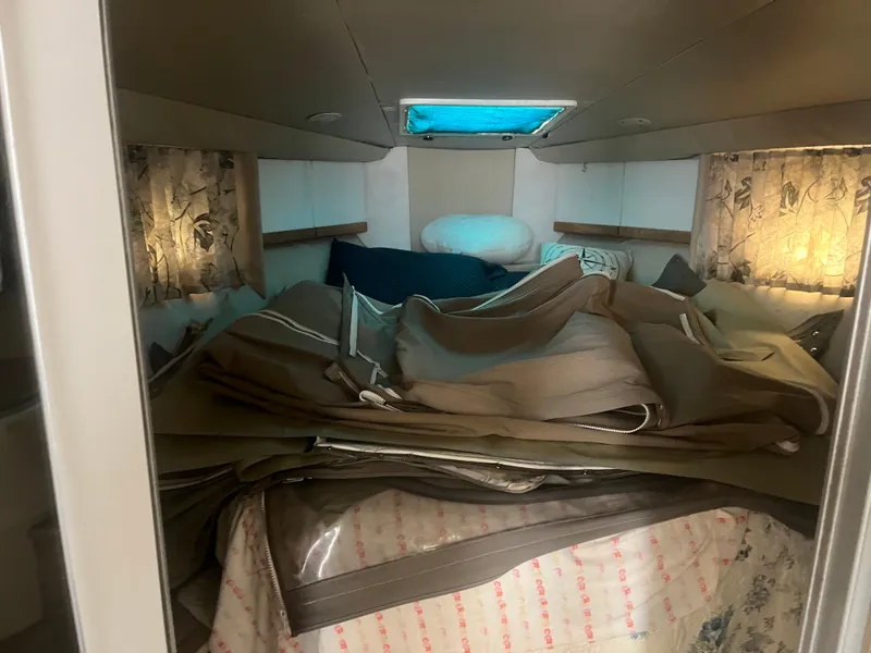 Slide: The Image of Interior cabin of a 1998 Formula 41PC boat with bedding and cushions. - 10