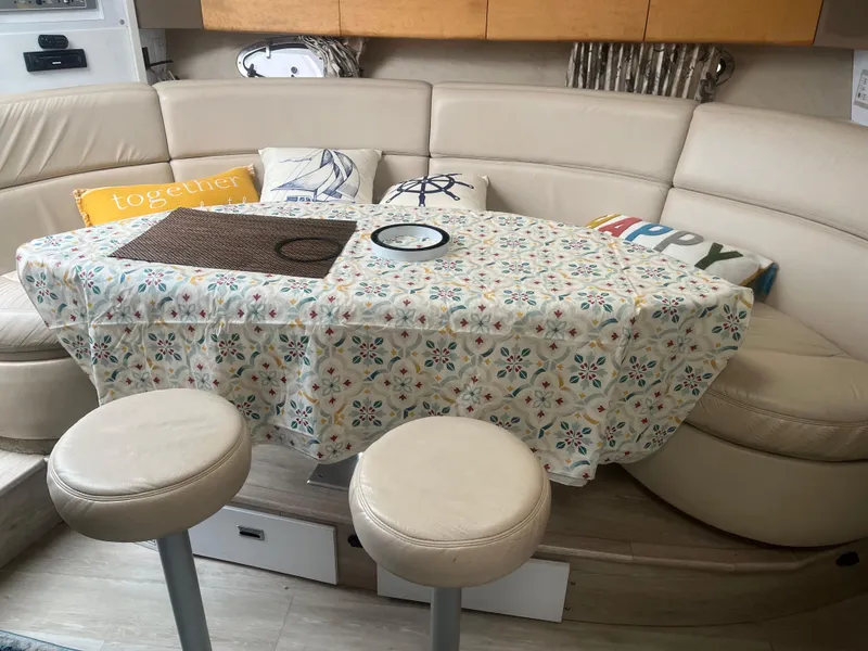 Slide: The Image of Cozy interior of 1998 Formula 41PC yacht with cushioned seating and decorative pillows. - 3