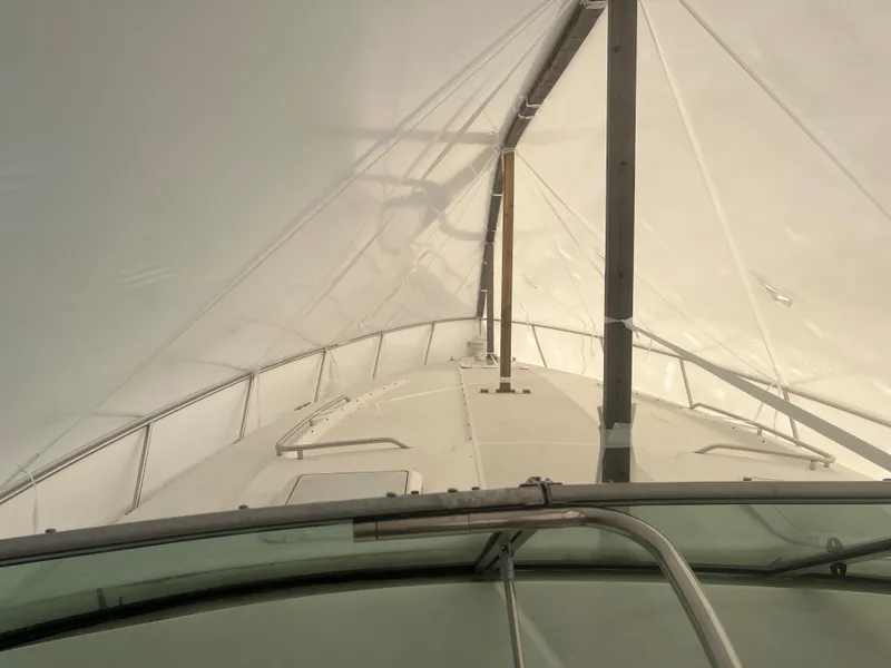 Slide: The Image of 1998 Formula 41PC boat under protective cover, view from helm. - 5