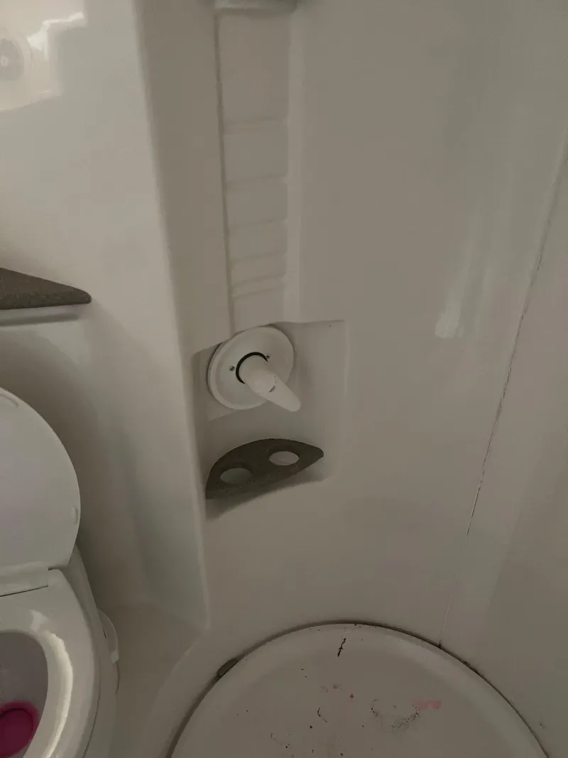 Slide: The Image of 1998 Formula 41PC bathroom with shower controls and toilet. - 7