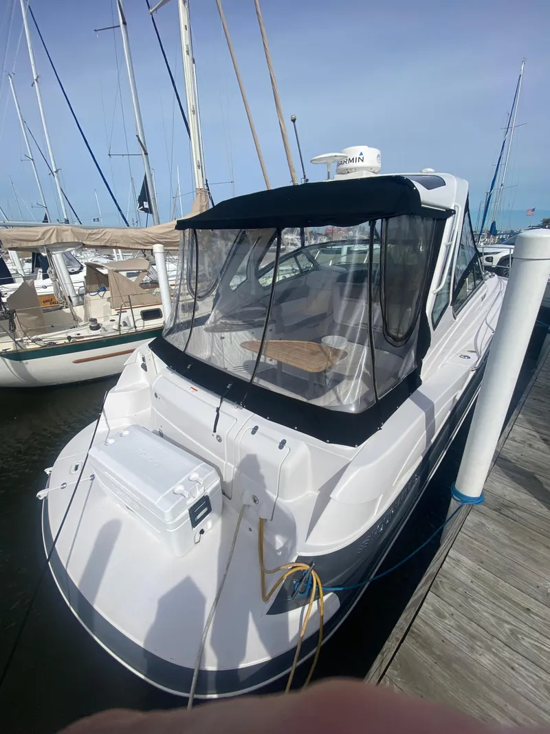 Slide: The Image of 2018 Four Winns 355 Vista boat docked at marina. - 5