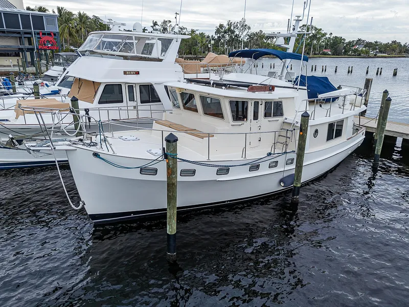 Slide: The Image of 2004 Kadey-Krogen Krogen North Sea yacht docked at a marina. - 2
