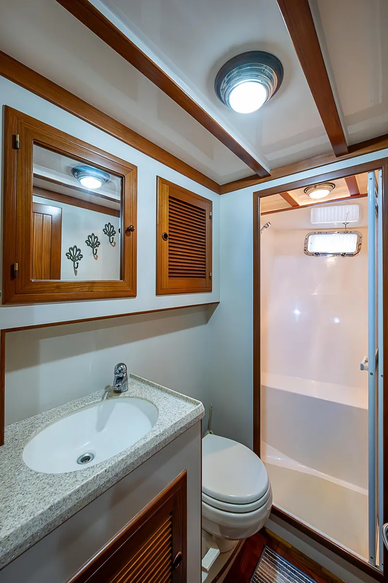 Slide: The Image of 2004 Kadey-Krogen North Sea yacht bathroom with wood accents and modern fixtures. - 20