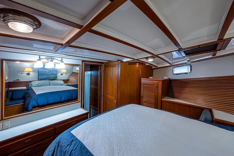 Slide: The Image of Luxurious 2004 Kadey-Krogen Krogen North Sea yacht bedroom with elegant wood finishes. - 24