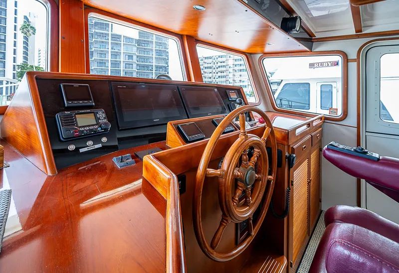 Slide: The Image of Pilothouse interior of 2004 Kadey-Krogen Krogen North Sea yacht with wooden steering wheel. - 28