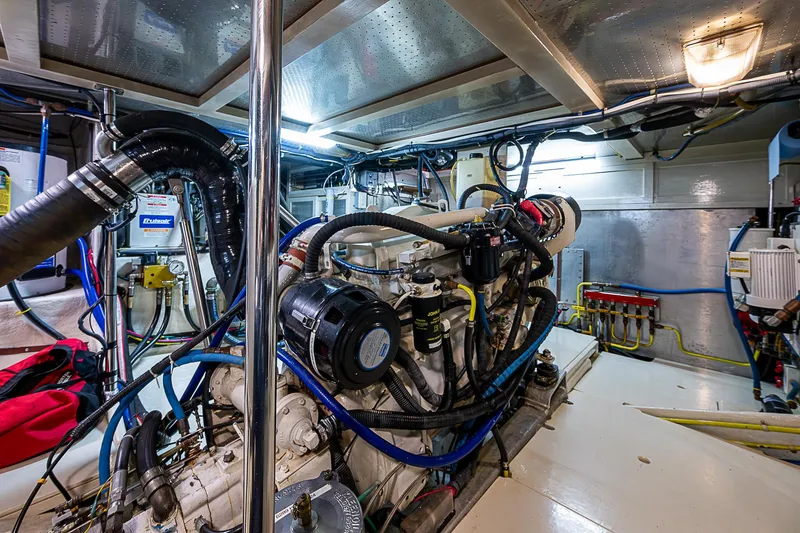 Slide: The Image of Engine room of 2004 Kadey-Krogen Krogen North Sea yacht, showcasing complex machinery and wiring. - 35