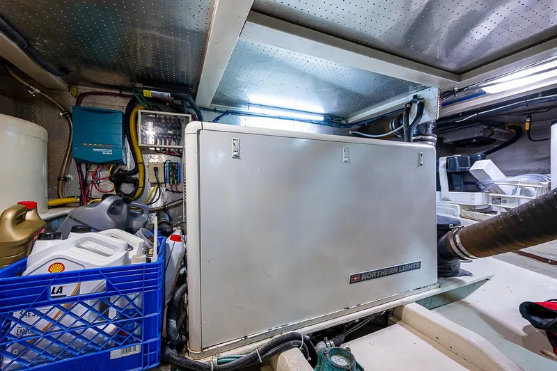 Slide: The Image of Engine room of 2004 Kadey-Krogen Krogen North Sea yacht, featuring equipment and storage. - 36