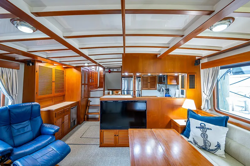 Slide: The Image of Luxurious 2004 Kadey-Krogen North Sea yacht interior with wood finishes and comfortable seating. - 7