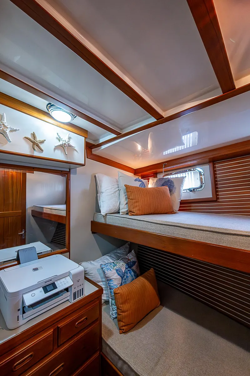 Slide: The Image of 2004 Kadey-Krogen Krogen North Sea cabin with cozy bunk beds and nautical decor. - 19