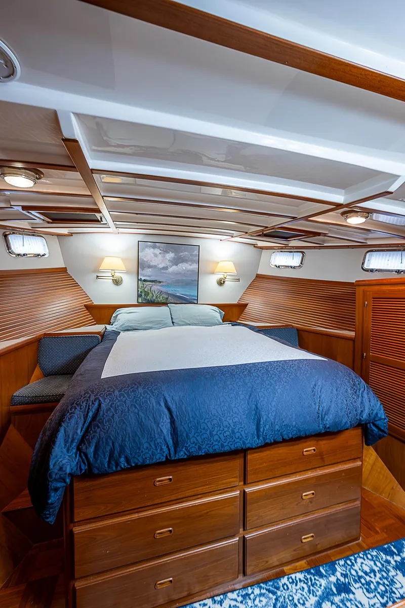 Slide: The Image of Luxurious 2004 Kadey-Krogen North Sea yacht bedroom with wooden accents and cozy bedding. - 22