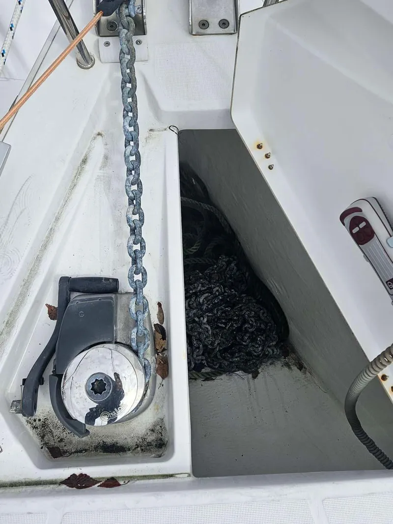 Slide: The Image of Anchor chain and windlass on 2012 Beneteau Oceanis 41 sailboat deck. - 11