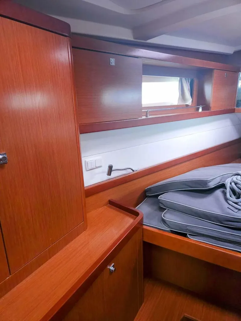 Slide: The Image of Interior cabin of 2012 Beneteau Oceanis 41 sailboat with wooden furnishings. - 16