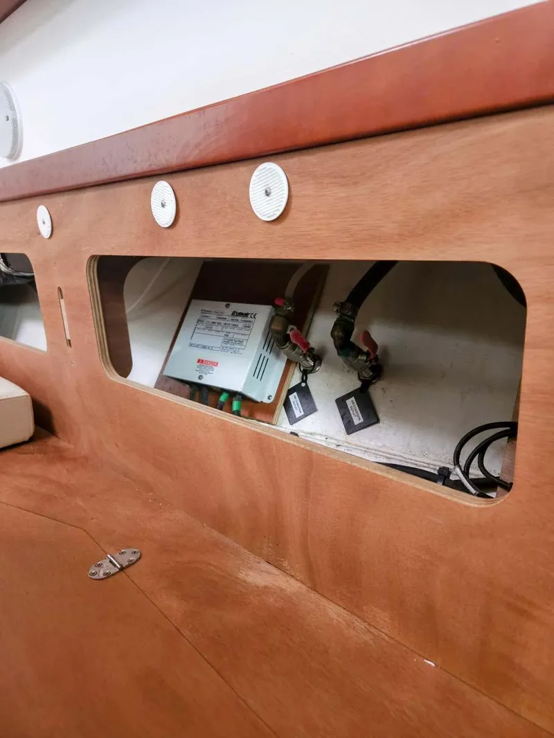 Slide: The Image of Interior view of 2012 Beneteau Oceanis 41 sailboat showing electrical panel and wiring. - 19