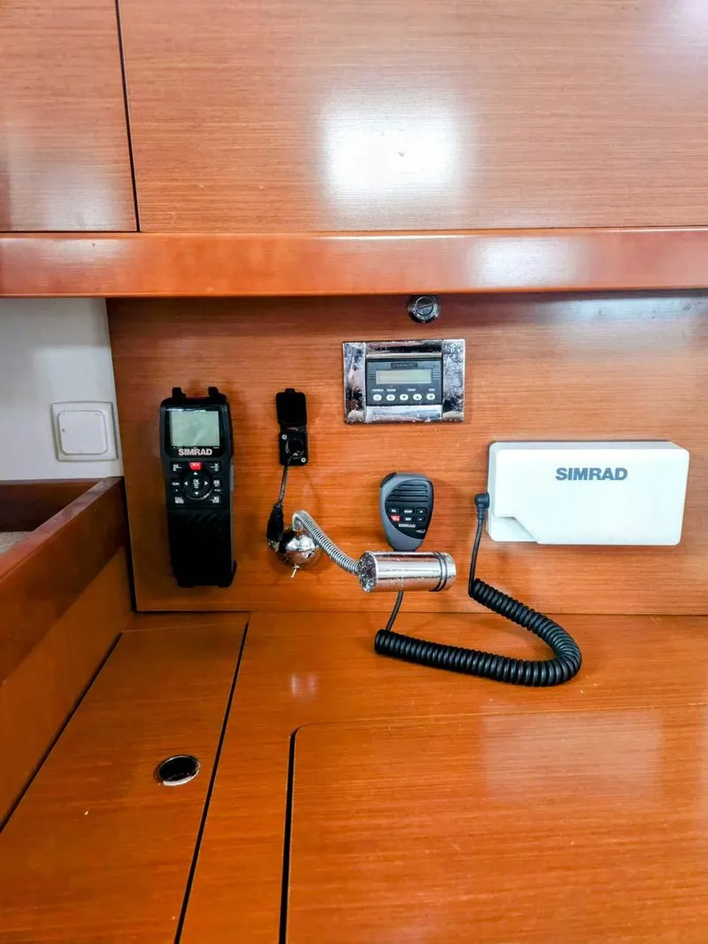 Slide: The Image of Control panel of a 2012 Beneteau Oceanis 41 sailboat with communication equipment. - 21