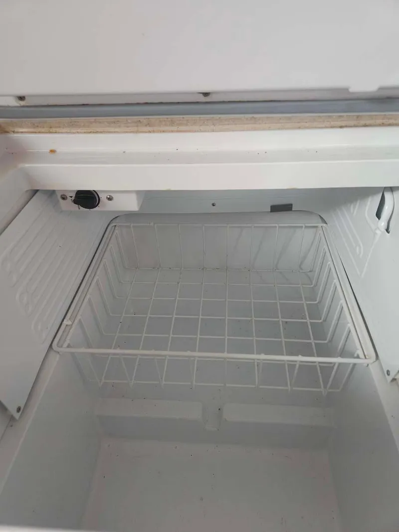 Slide: The Image of Empty freezer compartment on a 2012 Beneteau Oceanis 41 sailboat. - 24