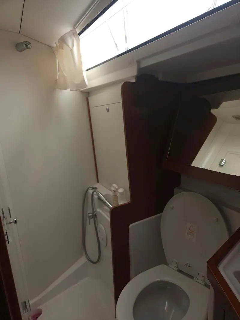 Slide: The Image of 2012 Beneteau Oceanis 41 yacht bathroom with toilet and shower. - 27