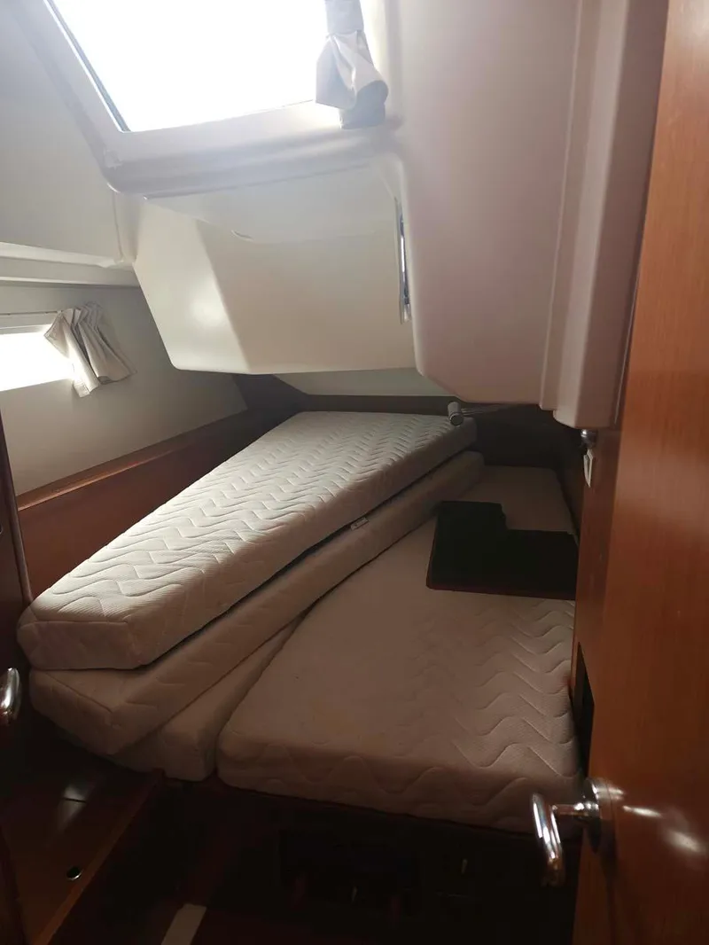 Slide: The Image of Interior cabin of 2012 Beneteau Oceanis 41 sailboat with twin beds. - 28