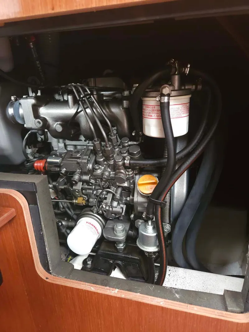 Slide: The Image of Engine compartment of 2012 Beneteau Oceanis 41 sailboat, showcasing detailed mechanical components. - 30