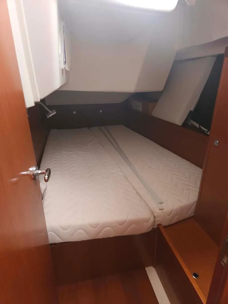 Slide: The Image of Interior cabin of 2012 Beneteau Oceanis 41 sailboat with cozy bed. - 32