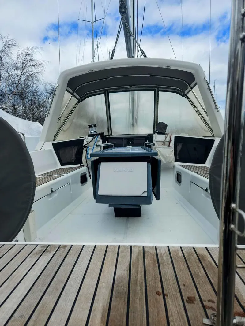 Slide: The Image of 2012 Beneteau Oceanis 41 sailboat cockpit with wooden deck and covered helm. - 4