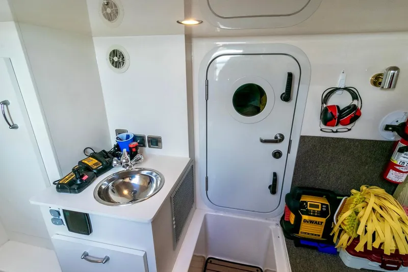 Slide: The Image of Utility Room w/ Access to Engine Room  - 54