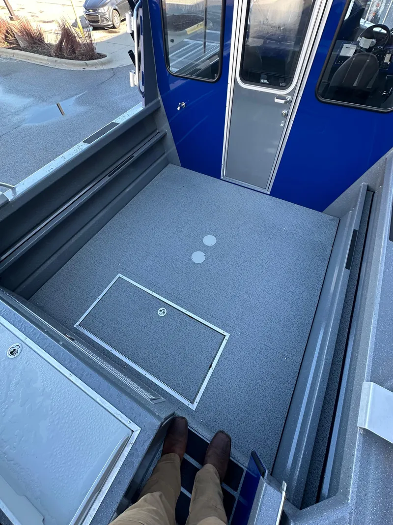 Slide: The Image of 2025 Spartan 240 Maximus Pro boat interior with spacious deck and modern design. - 8