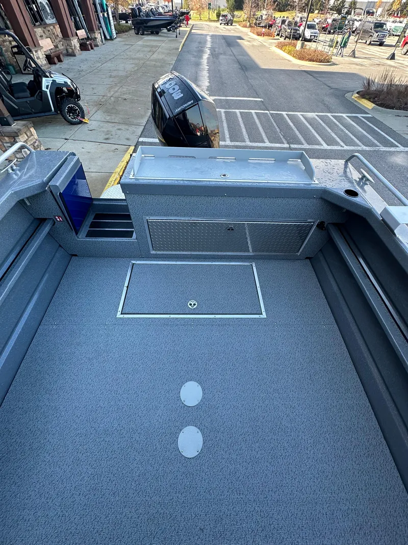 Slide: The Image of 2025 Spartan 240 Maximus Pro boat interior with spacious deck and storage compartments. - 9