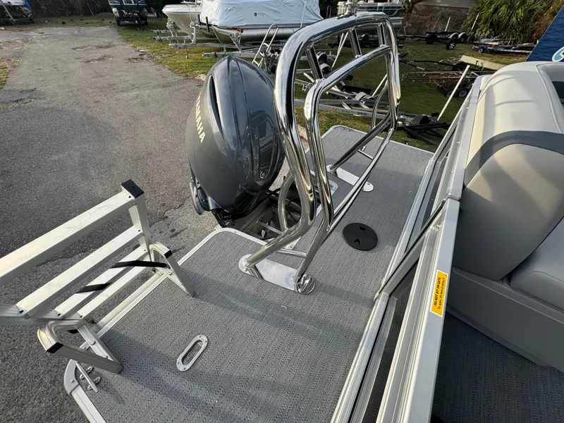 Slide: The Image of 2025 Sweetwater 2286 CSE boat with Yamaha motor and ladder on deck. - 10