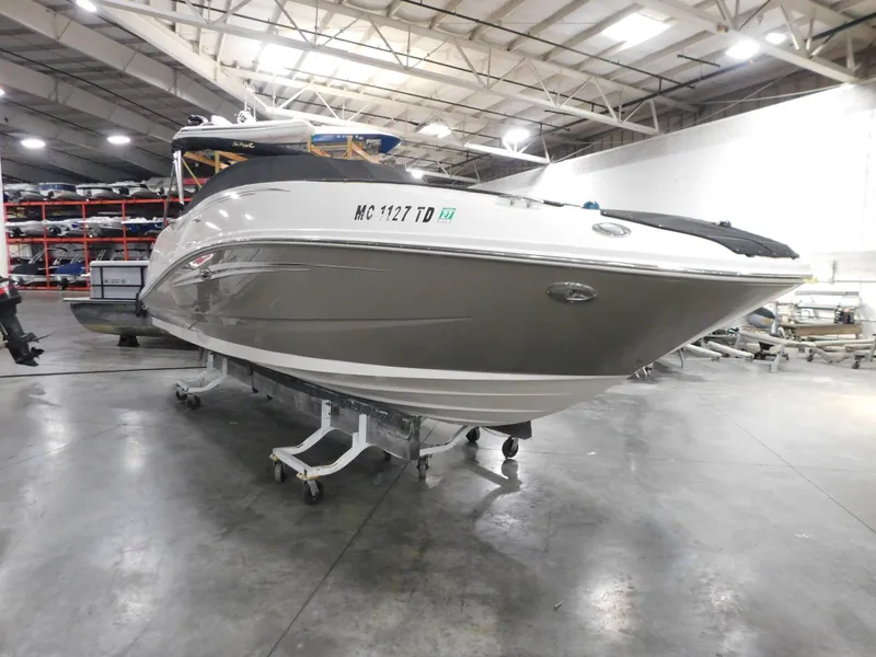 The Image of 2007 Sea Ray 260 Sundeck boat in indoor storage facility. - 1