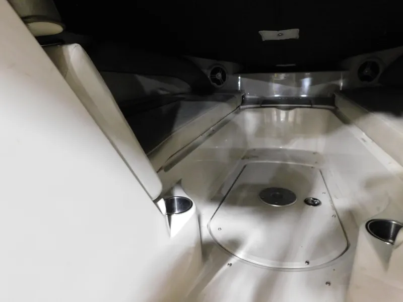 Slide: The Image of Interior view of 2007 Sea Ray 260 Sundeck boat, featuring sleek seating and cup holders. - 10